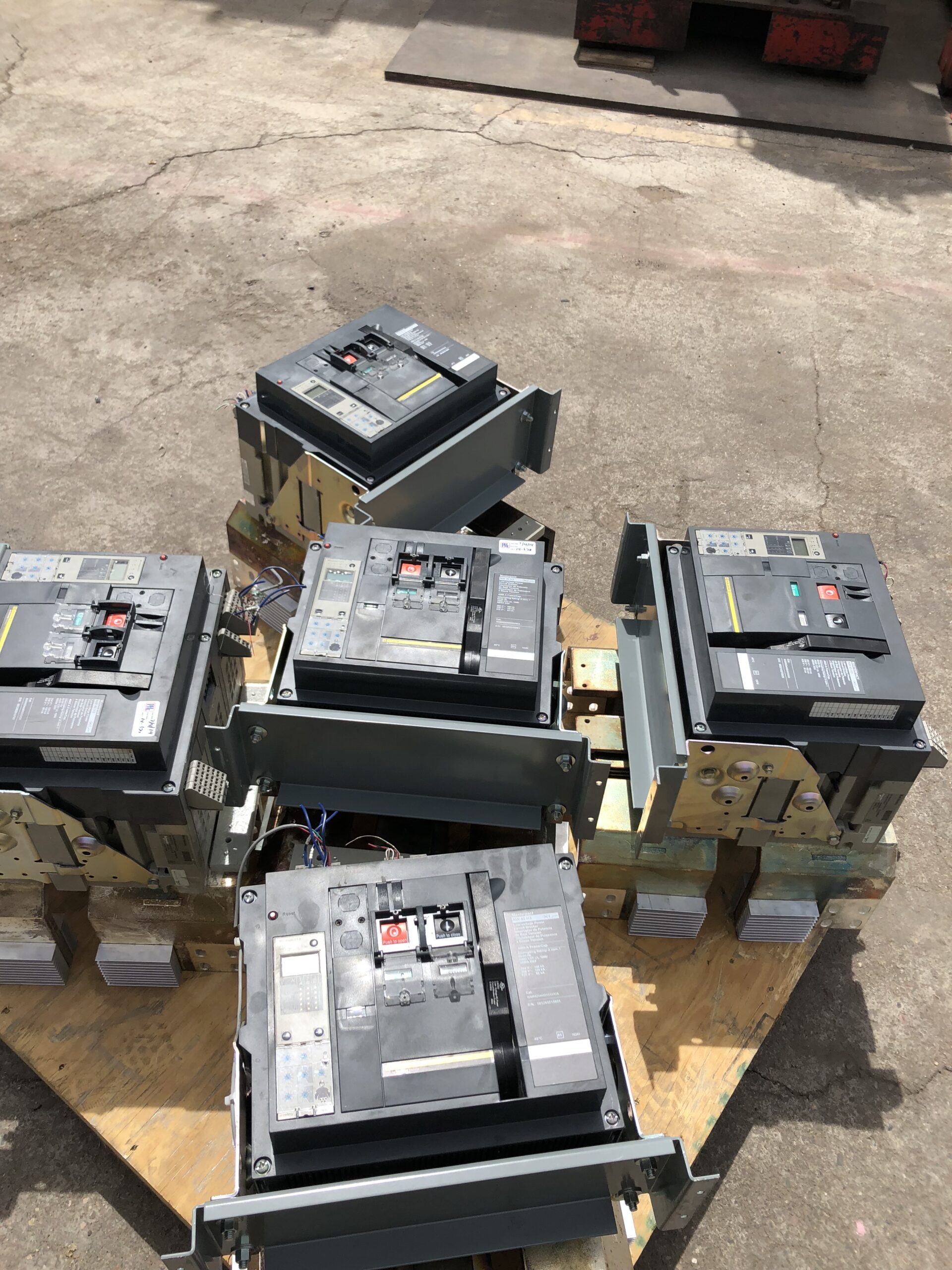 Palletized surplus equipment and cable spools loaded for pickup
